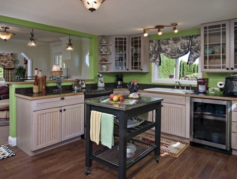 kitchen, island, green, cabinets, hardwood floors